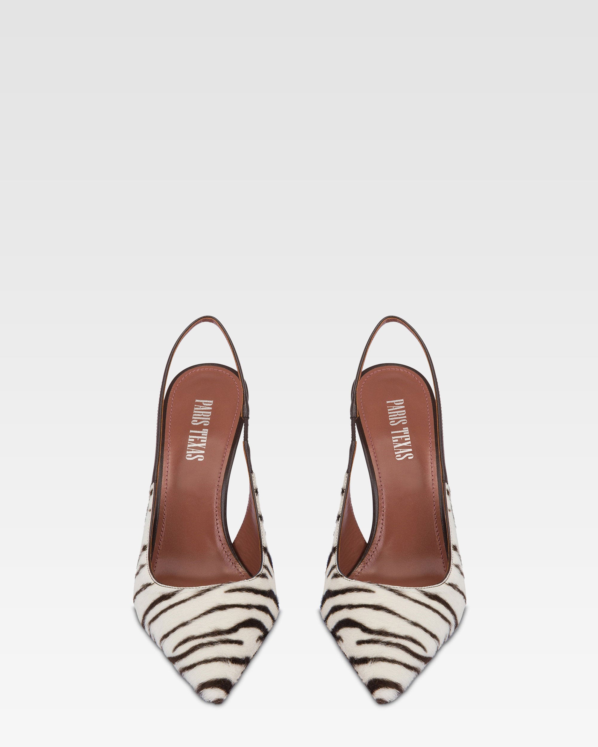 Slingbacks in white and ebony printed cowhide.