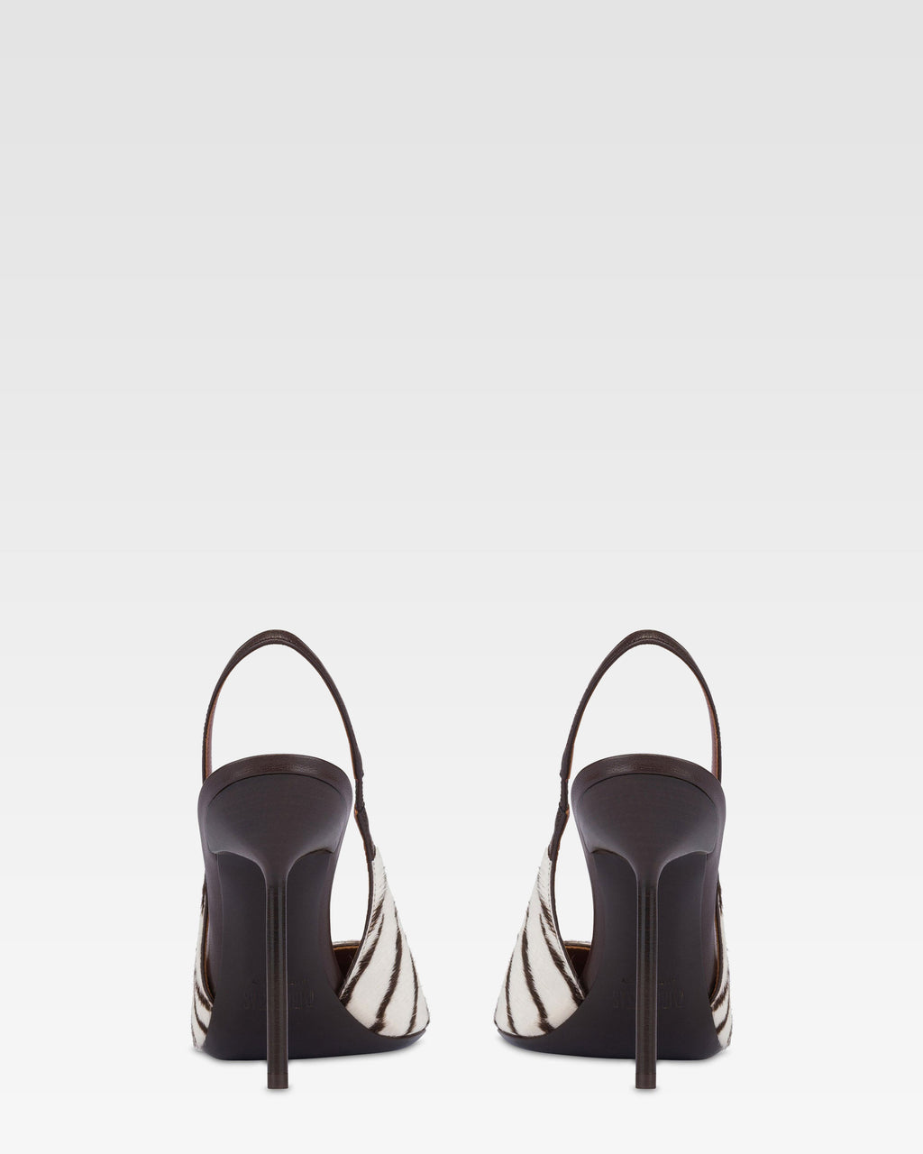 Slingbacks in white and ebony printed cowhide.
