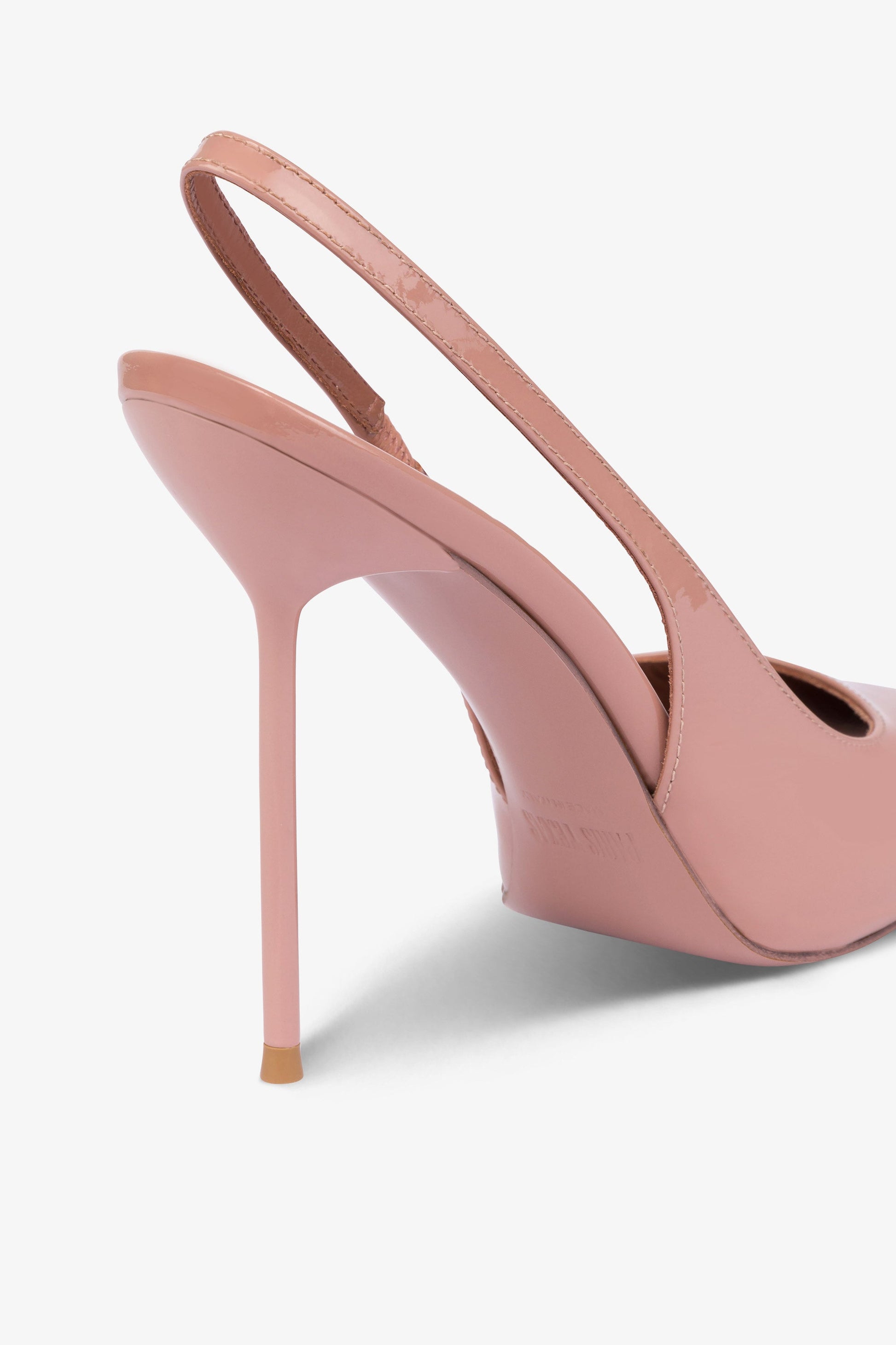 Sharp, pointed slingbacks in patent Texas pink leather