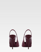 Slingbacks in rouge noir patent leather